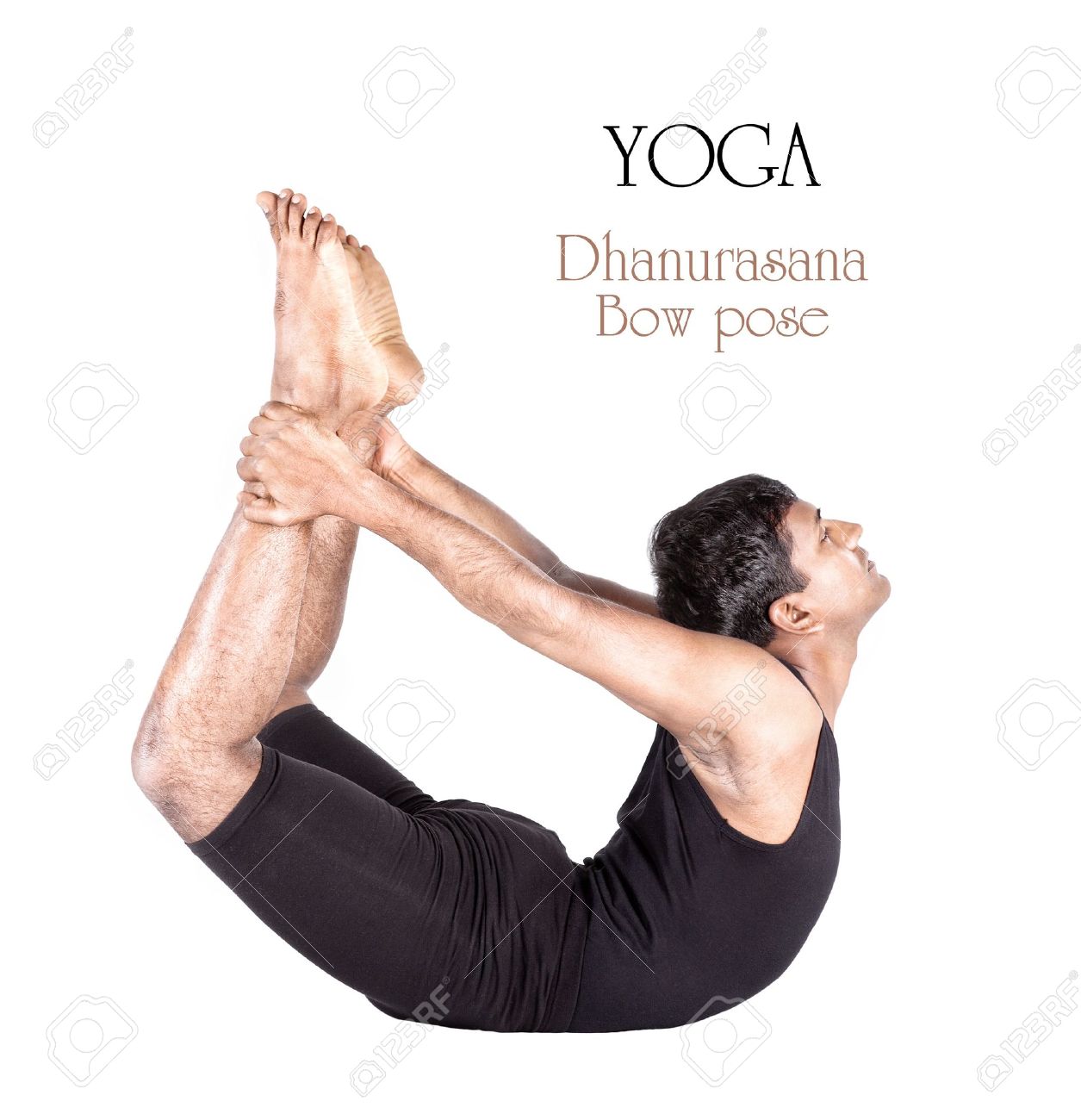 Yoga dhanurasana bow pose by Indian man in black cloth isolated.. Yoga dhanurasana bow pose by Indian man in black cloth isolated..