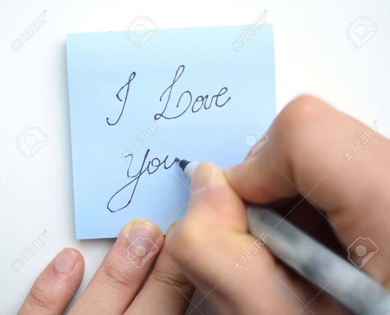 Hand Writing "I Love You!" With A Heart On A Sticky Note Pad Stock Photo,  Picture And Royalty Free Image. Image 64843629.