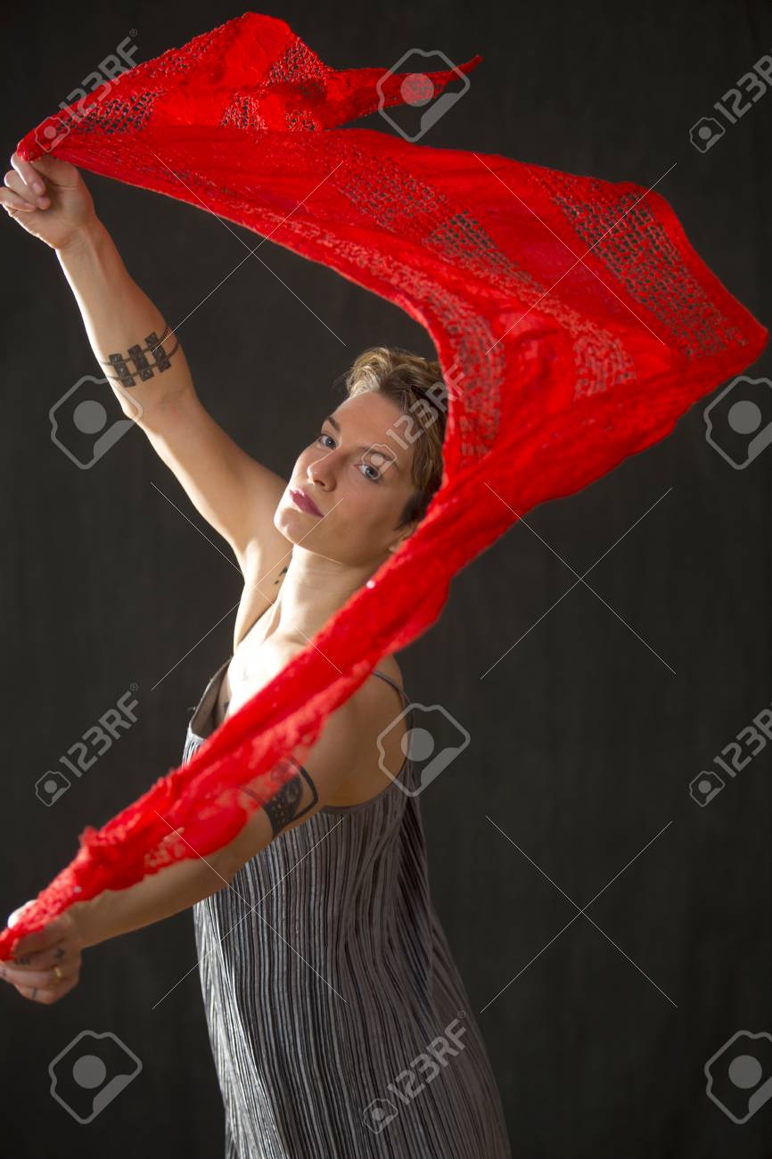 Attractive Young Woman Dancer With Short Hair In A Silver Bag