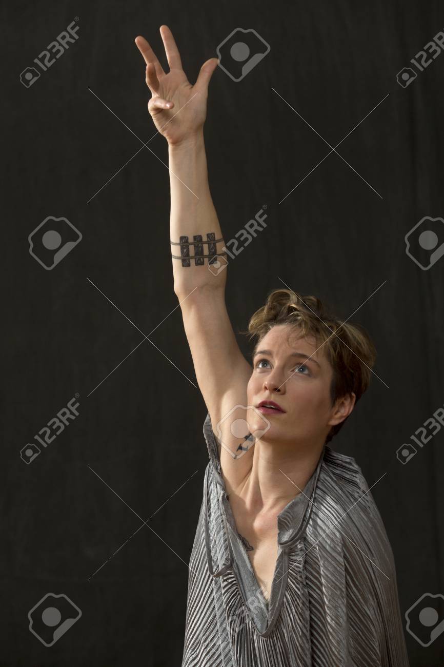Contemporary Young Woman Dancer With Short Hair In A Silver Bag