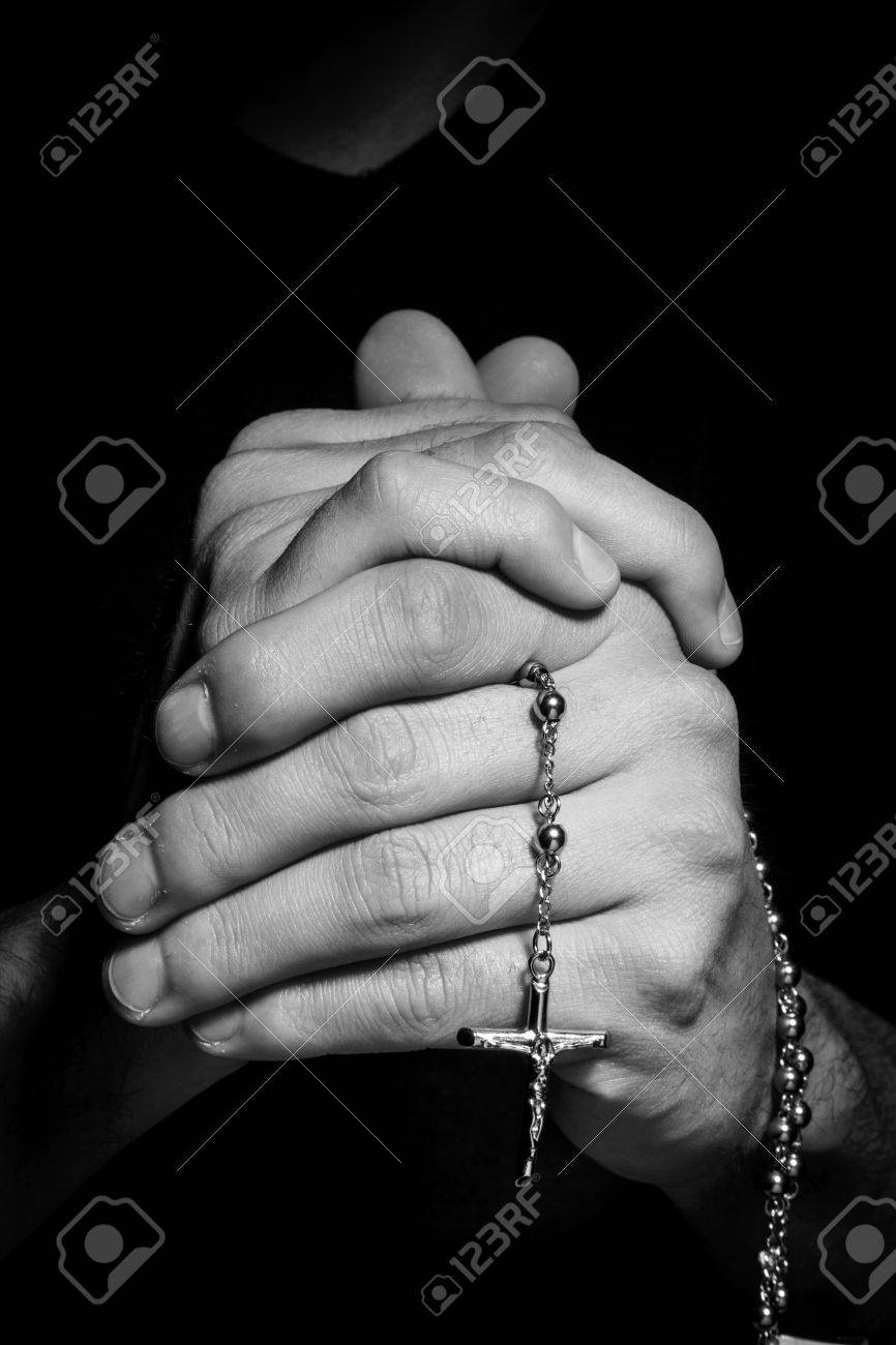 praying hands with rosay in black background stock photo picture