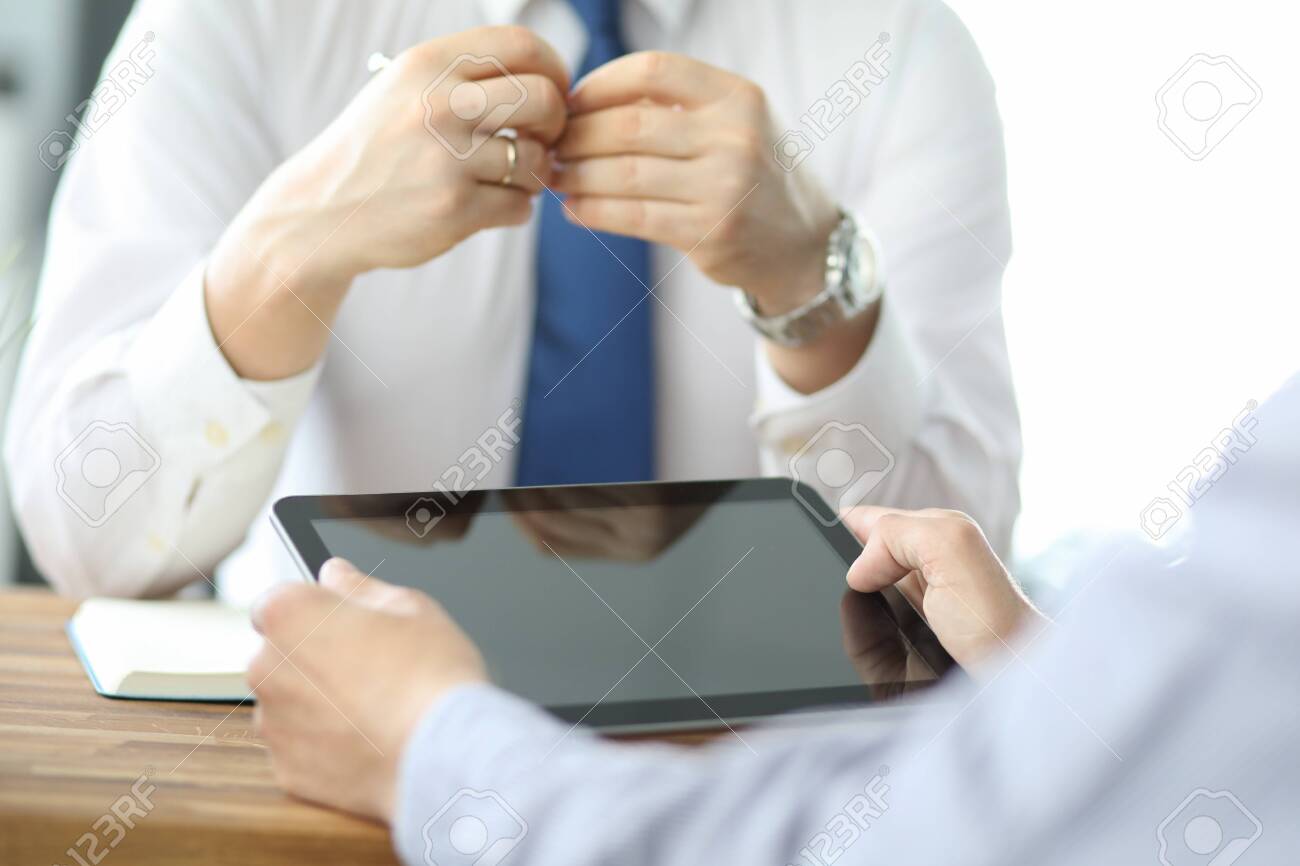Business team meeting to discuss statistical data presented in the form of digital graphs and charts - 134821352 Business team meeting to discuss statistical data presented in the form of digital graphs and charts - 134821352