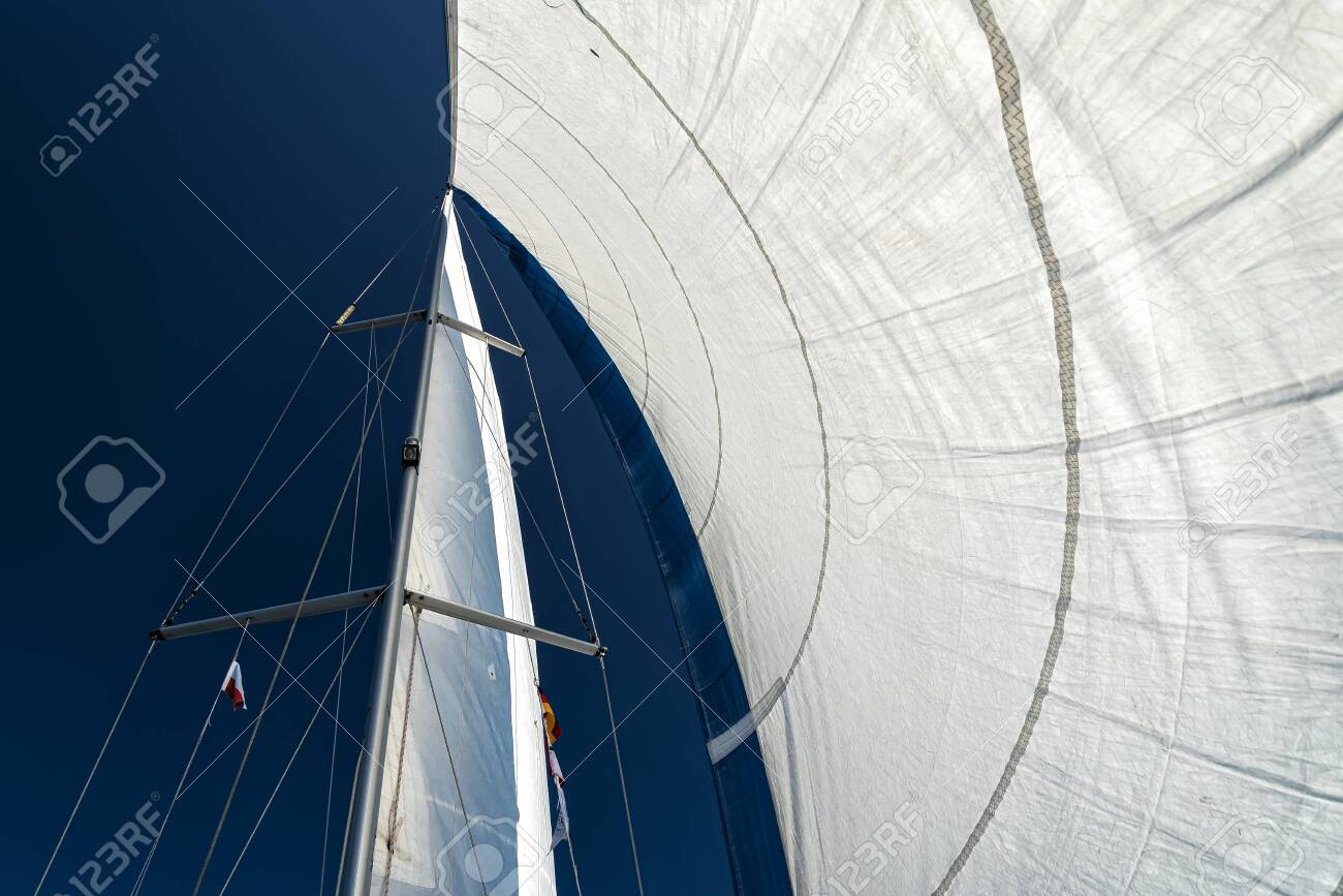 sails of a sailing yacht in the wind sailing on the ocean - 135156972 sails of a sailing yacht in the wind sailing on the ocean - 135156972