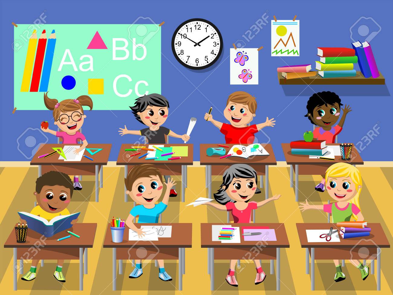 happy kids or children sitting at desk in the classroom at school