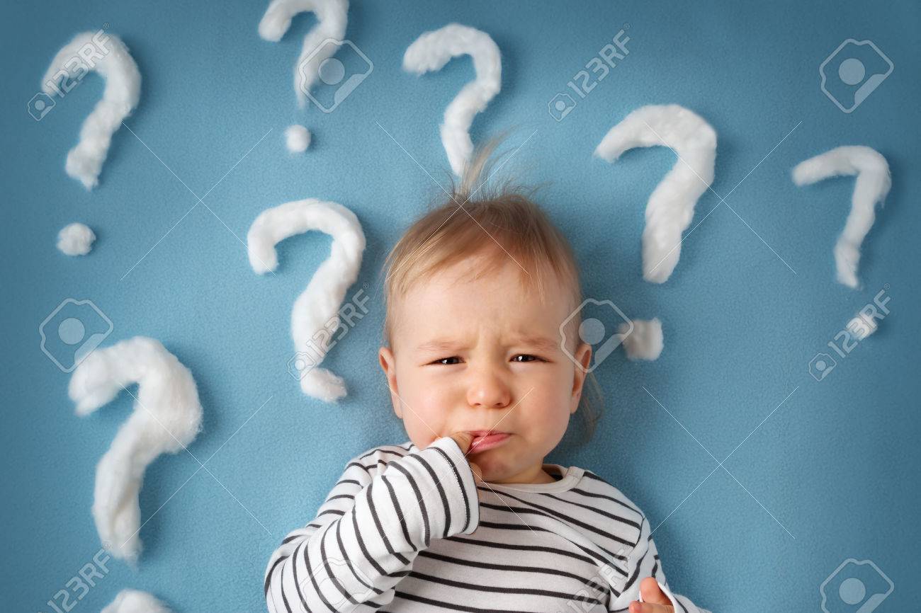 little boy lying on blue blanket with lots of question marks - 49032837 little boy lying on blue blanket with lots of question marks - 49032837