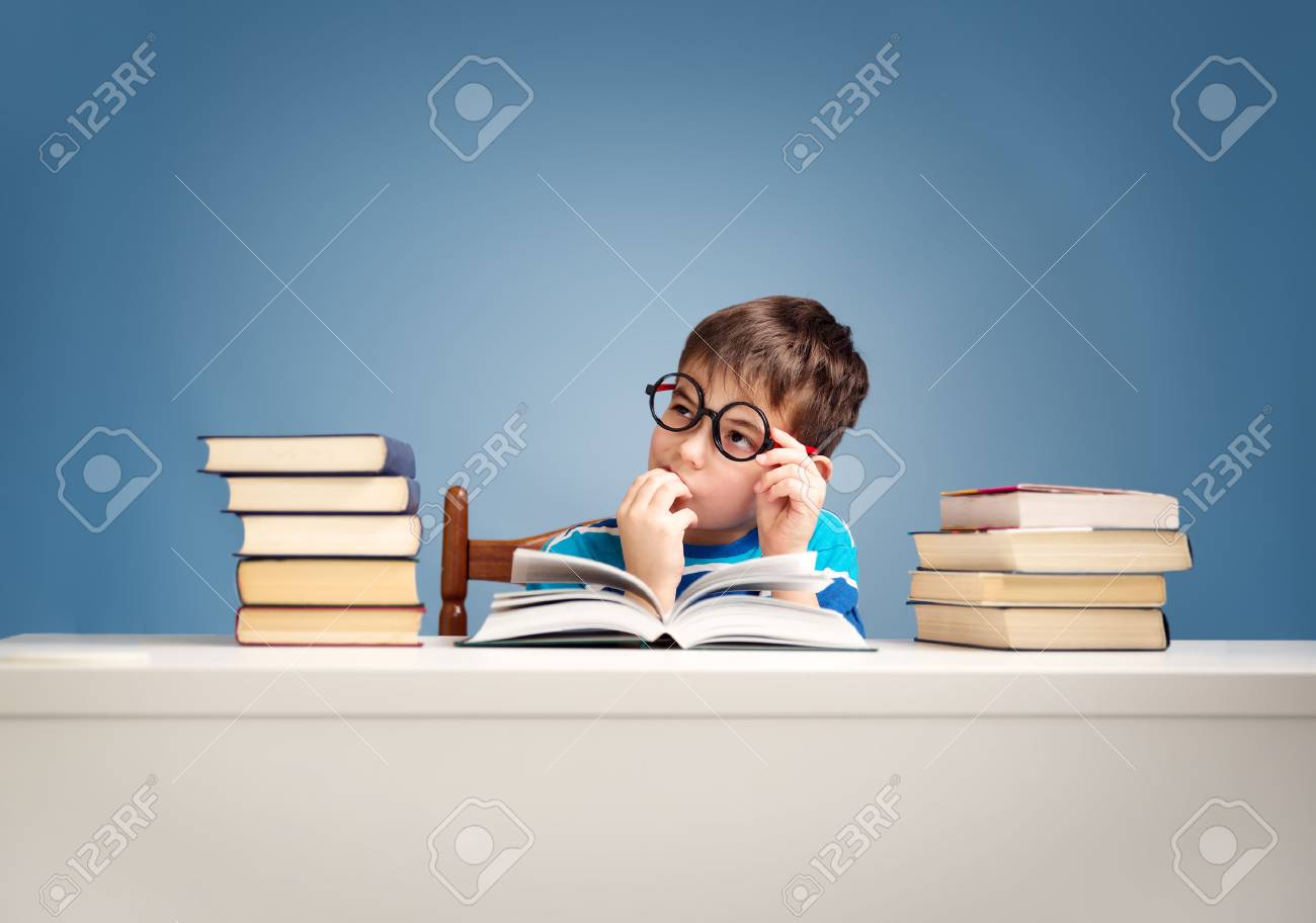 seven years old child reading a book - 78002398 seven years old child reading a book - 78002398