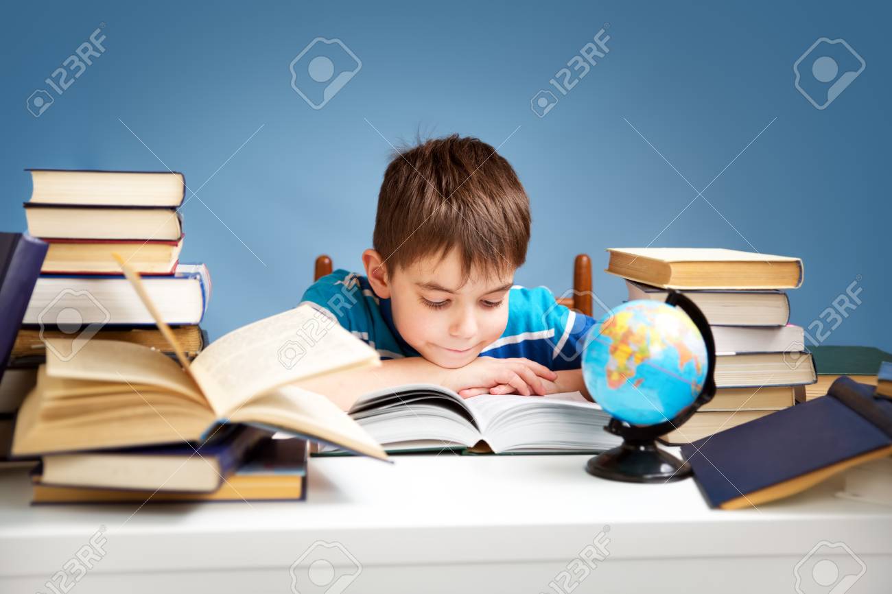 seven years old child reading a book - 80032425 seven years old child reading a book - 80032425