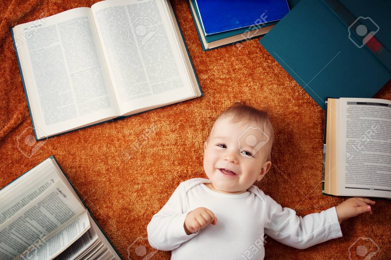 one year old baby with spectackles and books stock photo picture