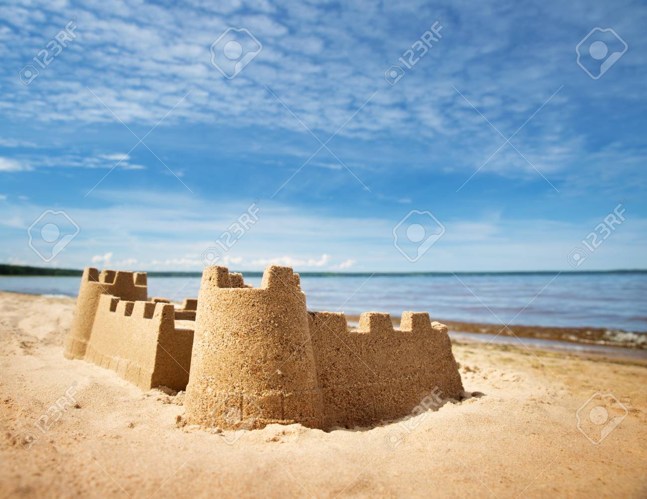 Sandcastle on the sea in summertime - 97186582 Sandcastle on the sea in summertime - 97186582