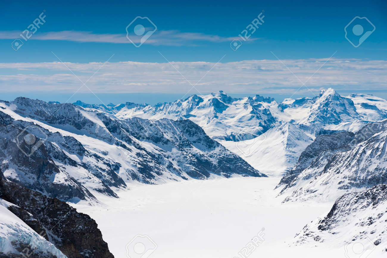 Aletsch Glacier/Fletsch Glacier. Panoramic view part of Swiss Alps alpine snow mountains landscape from Top of Europe at Jungfraujoch station, Switzerland - 131648538 Aletsch Glacier/Fletsch Glacier. Panoramic view part of Swiss Alps alpine snow mountains landscape from Top of Europe at Jungfraujoch station, Switzerland - 131648538