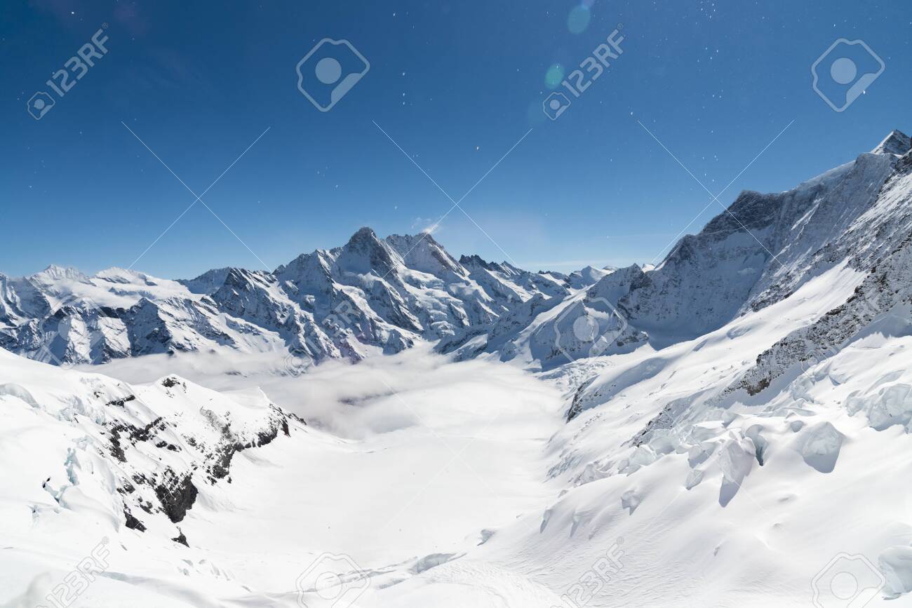 Aletsch Glacier/Fletsch Glacier. Panoramic view part of Swiss Alps alpine snow mountains landscape from Top of Europe at Jungfraujoch station, Switzerland - 131648431 Aletsch Glacier/Fletsch Glacier. Panoramic view part of Swiss Alps alpine snow mountains landscape from Top of Europe at Jungfraujoch station, Switzerland - 131648431
