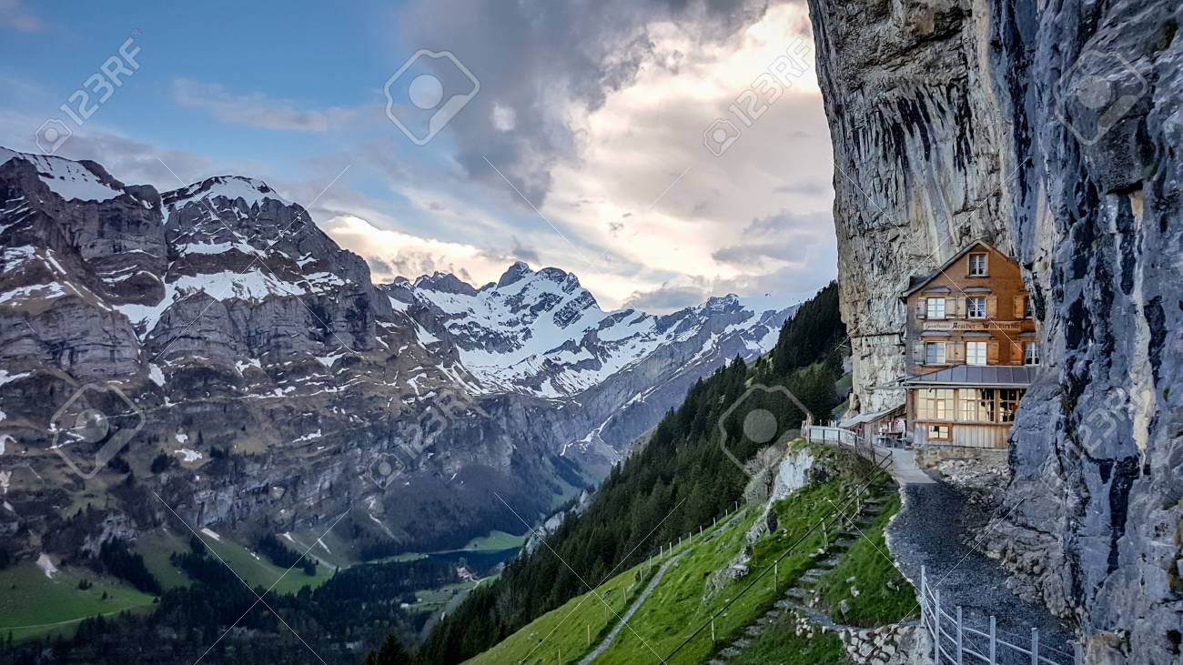 EBENALP, SWITZERLAND, May 2017: Ebenalp with its famous cliff inn Aescher. Ebenalp is an attractive recreation region for hiking, climbing, skiing and paragliding in Appenzell, Switzerland - 97885200 EBENALP, SWITZERLAND, May 2017: Ebenalp with its famous cliff inn Aescher. Ebenalp is an attractive recreation region for hiking, climbing, skiing and paragliding in Appenzell, Switzerland - 97885200