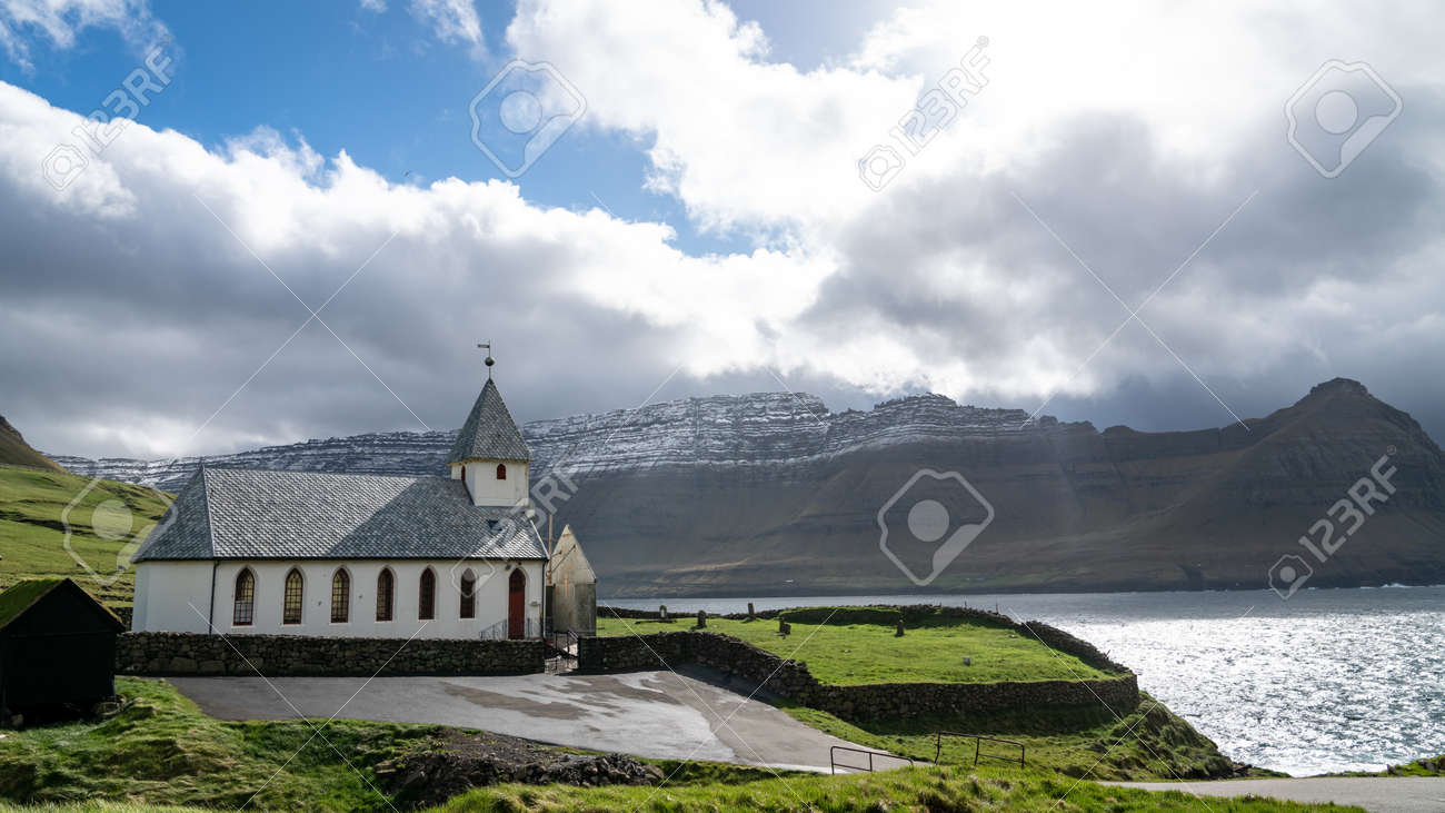 Vidareidi, Faroe Islands - August 2019: Vidareidi village with village's church, Vidoy island, Faroe Islands, Denmark. - 164356036 Vidareidi, Faroe Islands - August 2019: Vidareidi village with village's church, Vidoy island, Faroe Islands, Denmark. - 164356036
