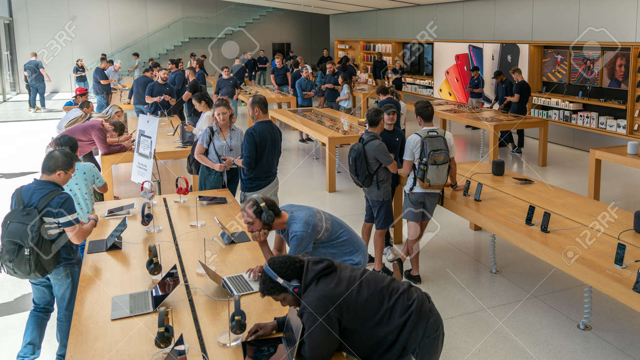 San Francisco, California, USA - August 2019: People examining Apple products laptops phones and tablets at Apple Store in Union Square - 164356010 San Francisco, California, USA - August 2019: People examining Apple products laptops phones and tablets at Apple Store in Union Square - 164356010