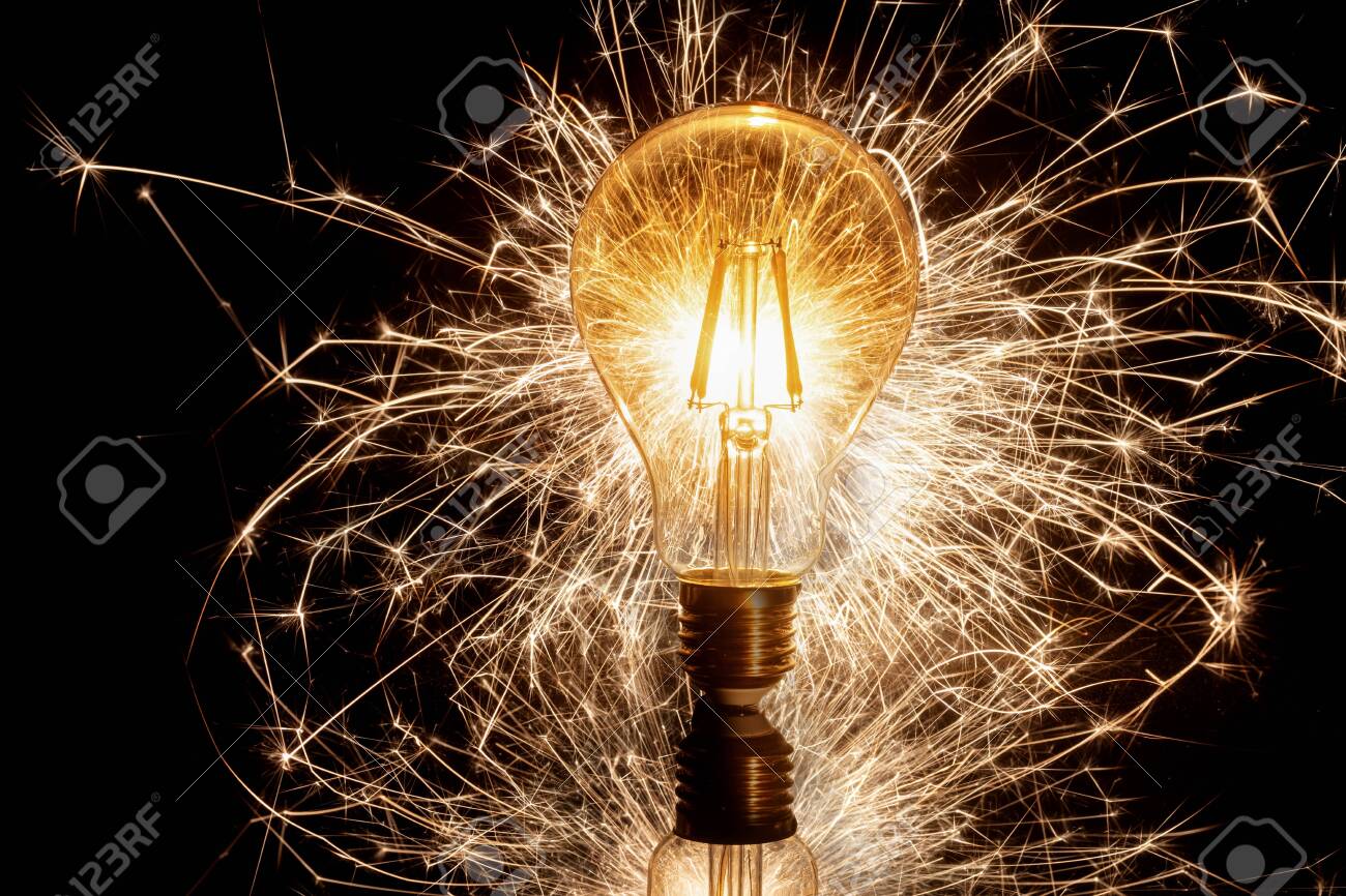 Spinning light bulb making attractive design in the night - 153589570 Spinning light bulb making attractive design in the night - 153589570
