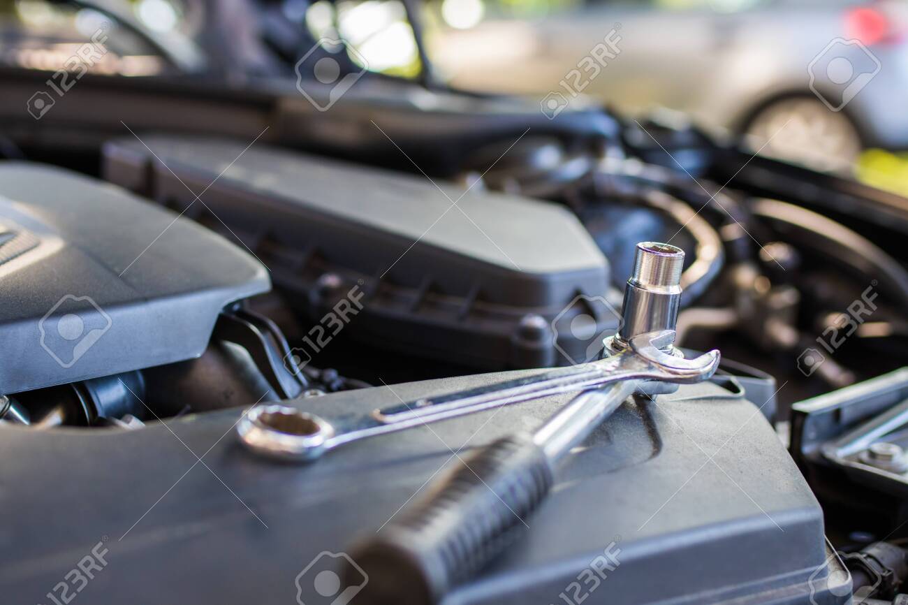 mechanical workshop, tools in the car engine - 133643009 mechanical workshop, tools in the car engine - 133643009