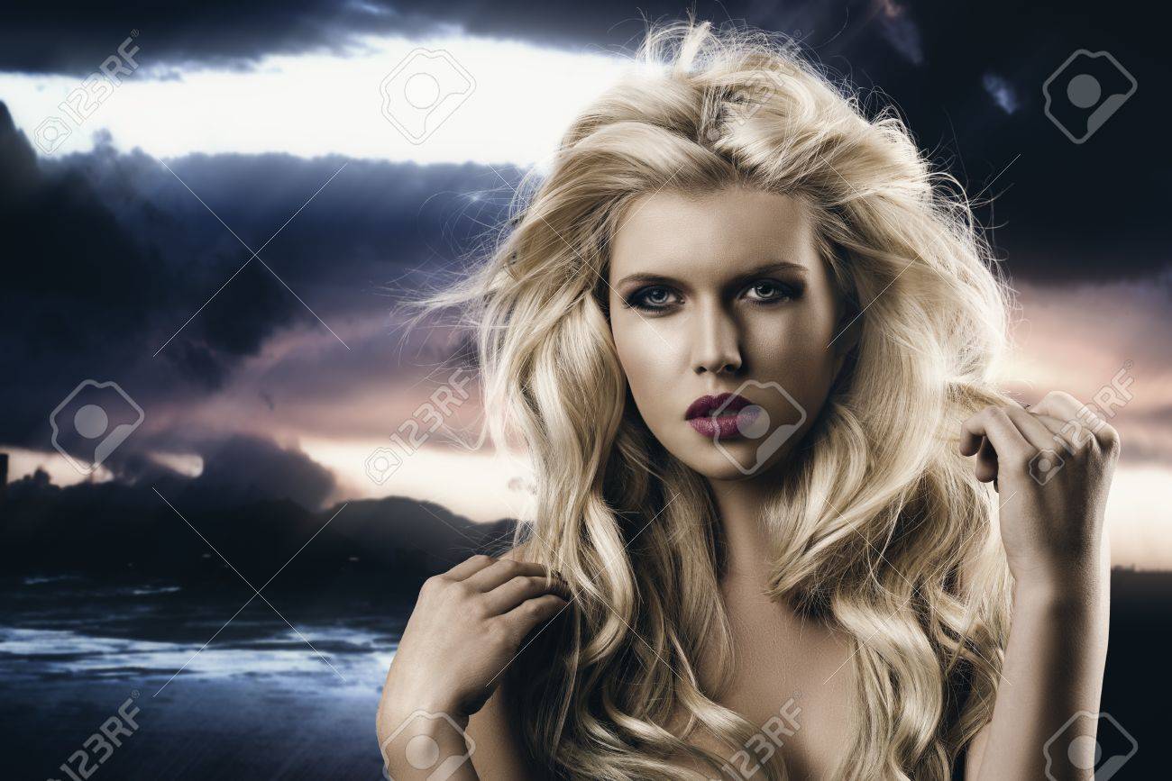 Portrait Of Young Sexy Girl With Blode Wavy Hairstyle And And