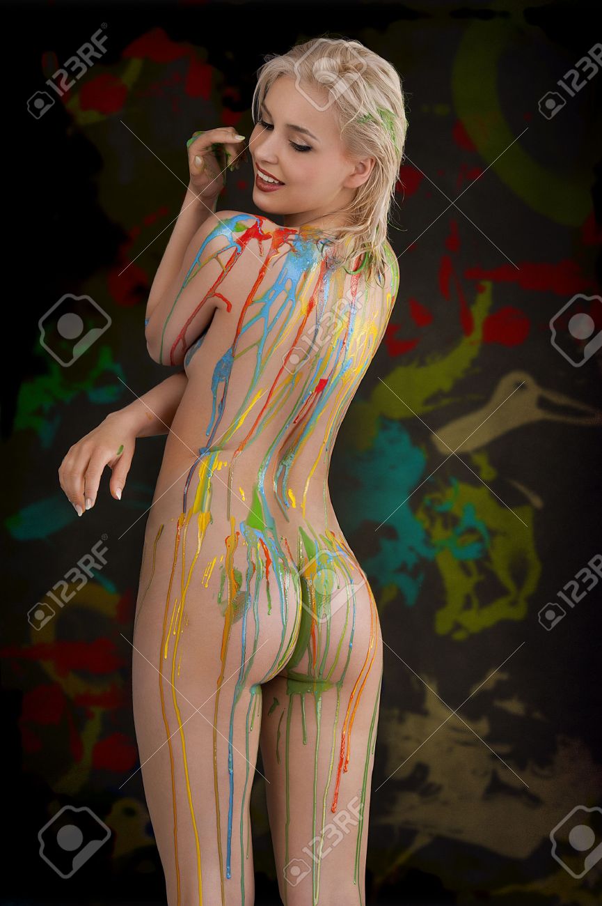 Nudist Body Painting Gallery - beautiful blond nude girl with multicolored body paint over her..