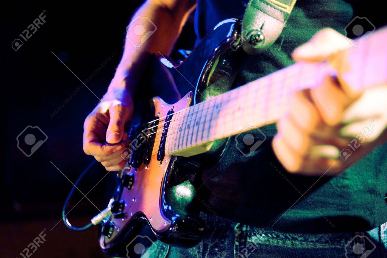 Close up image of guitar player on stage - 18586238 Close up image of guitar player on stage - 18586238