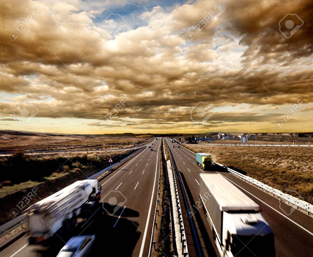 International shipment, trucks and cars driving on the highway. Logistics and warehousing - 50030414 International shipment, trucks and cars driving on the highway. Logistics and warehousing - 50030414