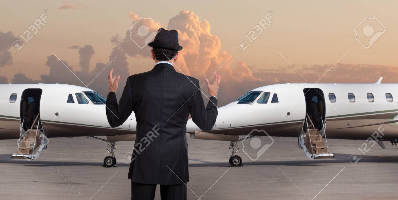 business man in front of two private jets stock photo picture and