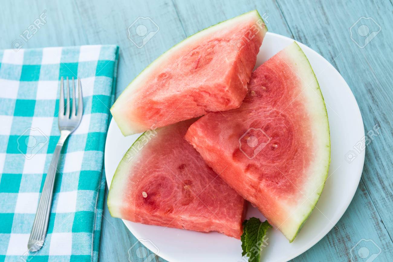 59952848-watermelon-snack-slices-on-white-plate-in-summertime.jpg