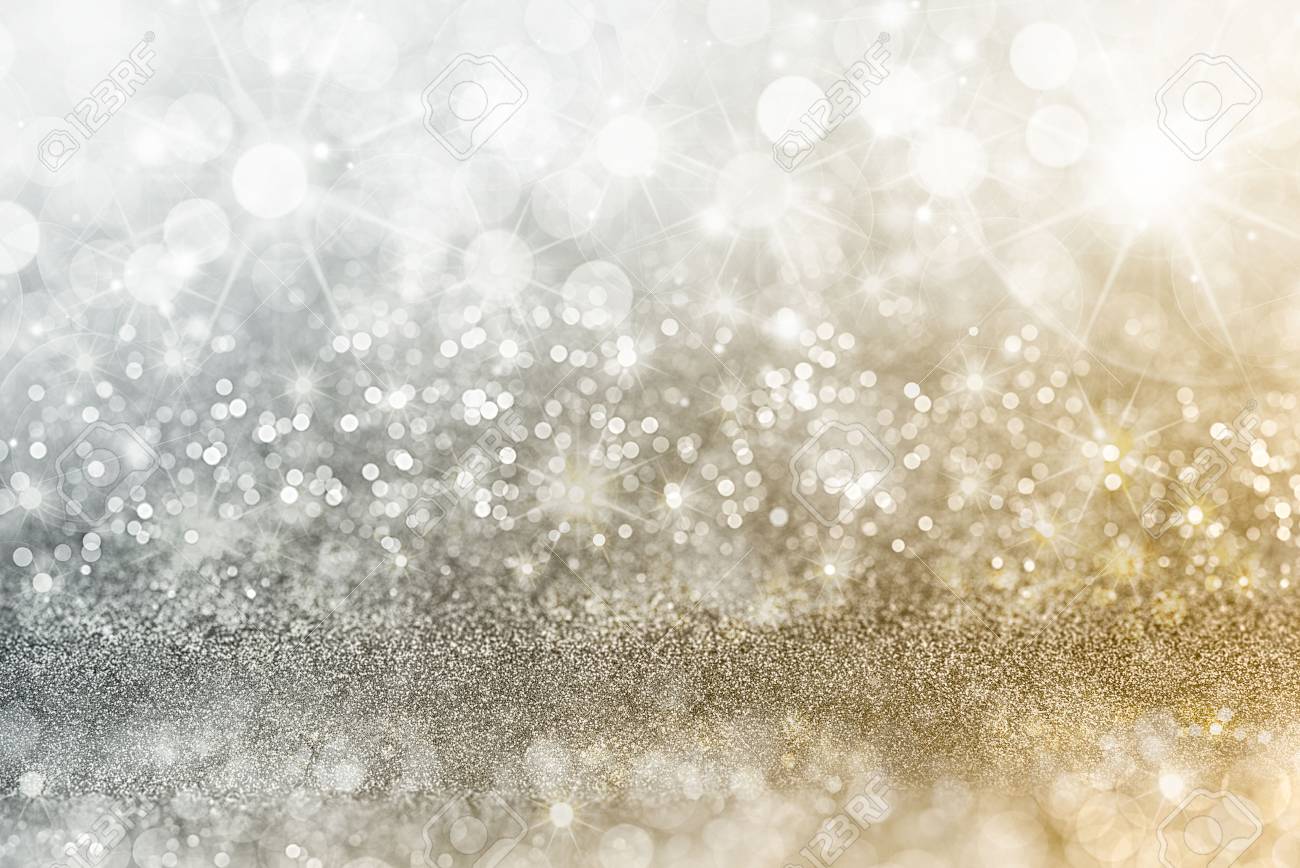 Silver and gold Christmas background with graduated bands of different sparkling and twinkling bokeh from party lights and glitter, full frame copyspace - 69713891 Silver and gold Christmas background with graduated bands of different sparkling and twinkling bokeh from party lights and glitter, full frame copyspace - 69713891