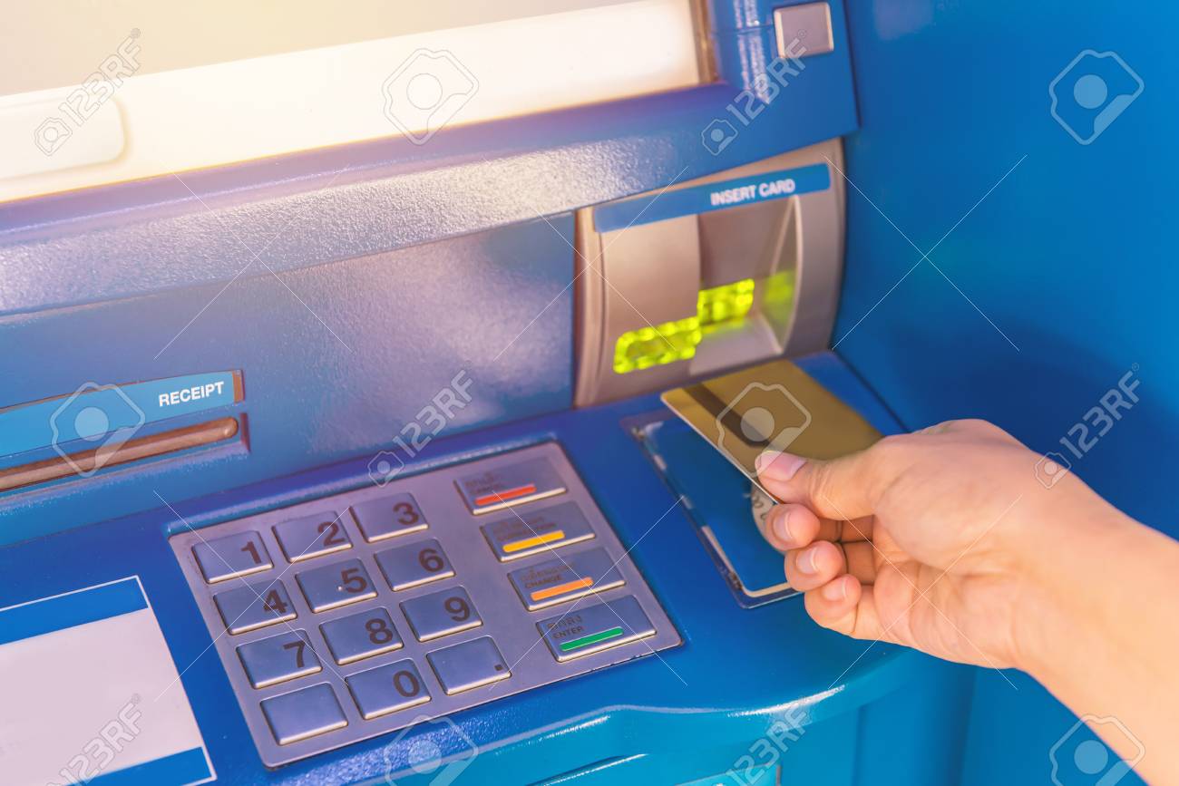 Hand Insert Credit Card To Atm Bank Cash Machine For Withdraw Money Stock Photo Picture And Royalty Free Image Image 75435353