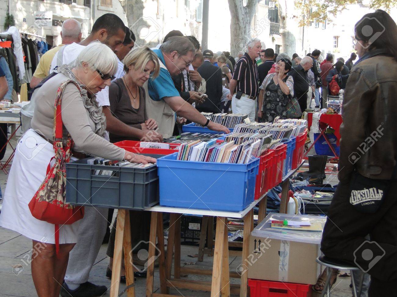 AVIGNON, FRANCE - OCT 2:Shoppers search for bargains at a weekly flea market on Oct 2, 2011, in Avignon, France. - 11501848 AVIGNON, FRANCE - OCT 2:Shoppers search for bargains at a weekly flea market on Oct 2, 2011, in Avignon, France. - 11501848