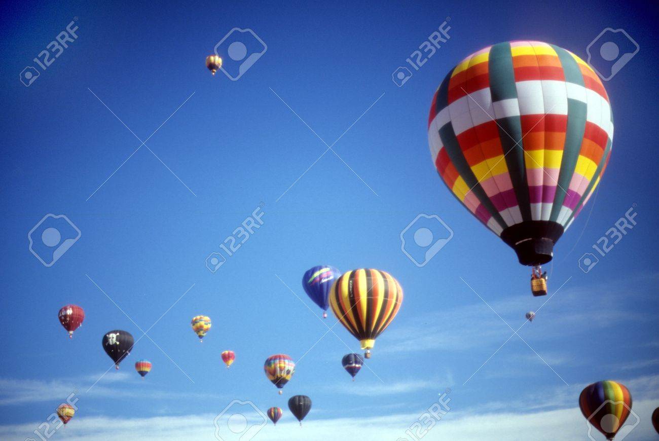 Hot air balloons against blue sky, International Balloon Festival, Albuquerque, New Mexico - 11654605 Hot air balloons against blue sky, International Balloon Festival, Albuquerque, New Mexico - 11654605