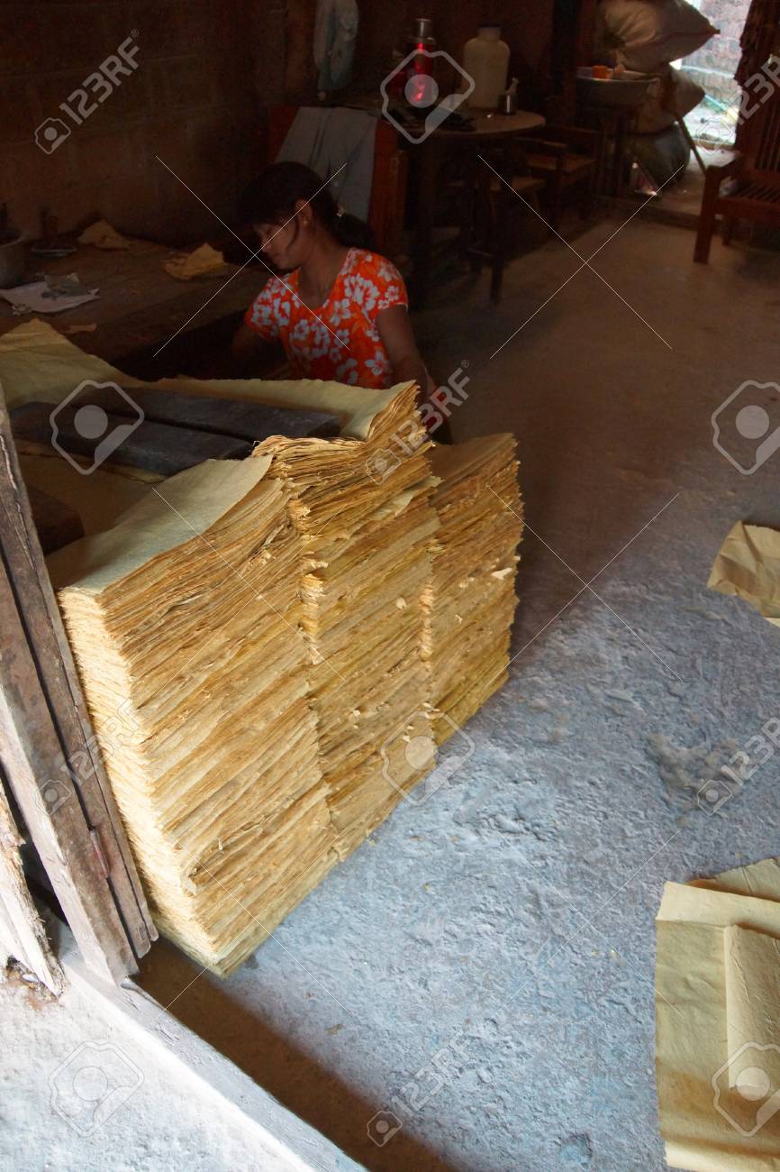 kyaukme myanmar feb 21 2015 young shan woman stacks sheets sheets of bamboo