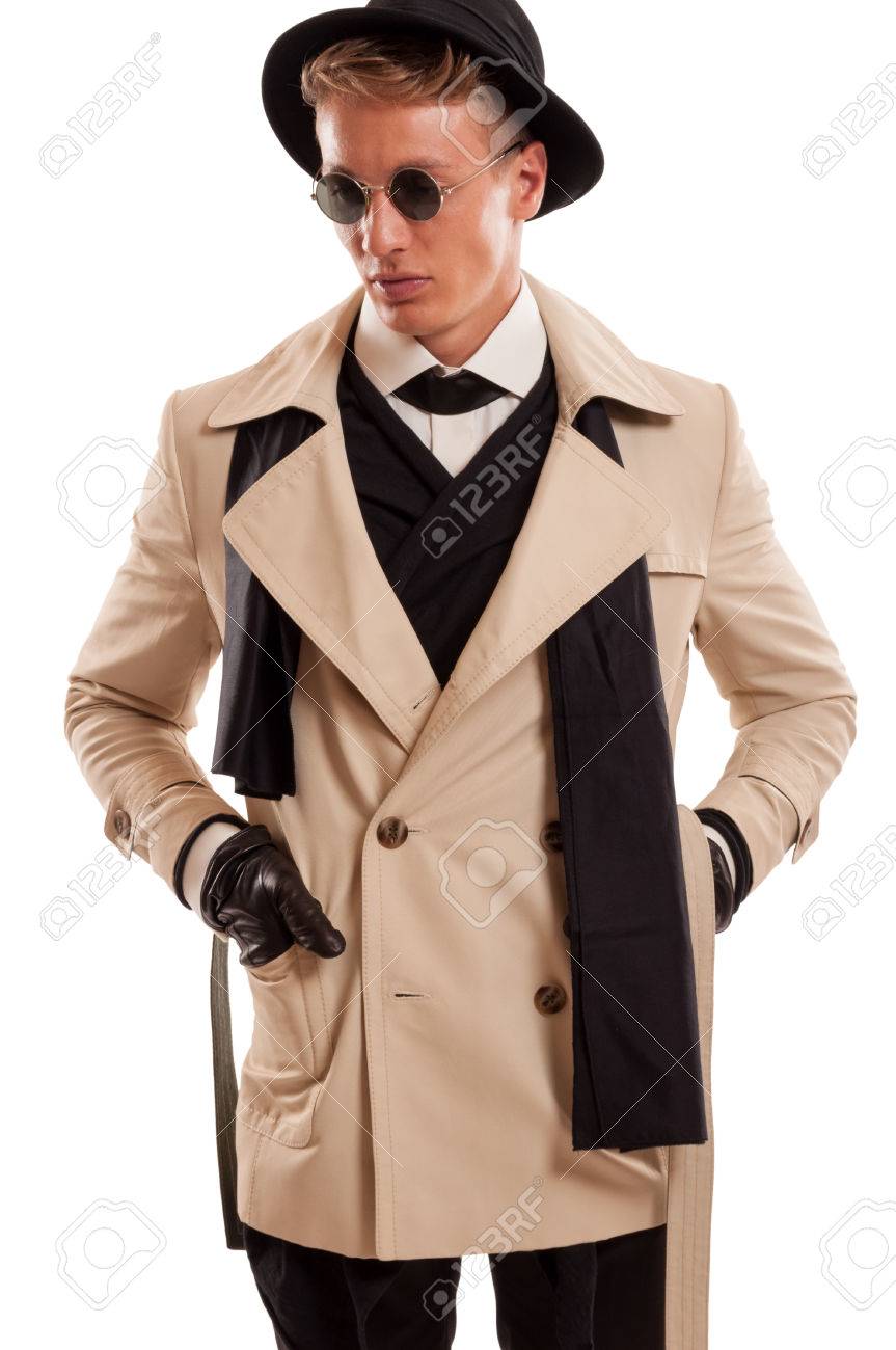 探偵コート サングラス アンダー カバー専用ミッションで遊んで派手な帽子を身に着けている男性モデル の写真素材 画像素材 Image