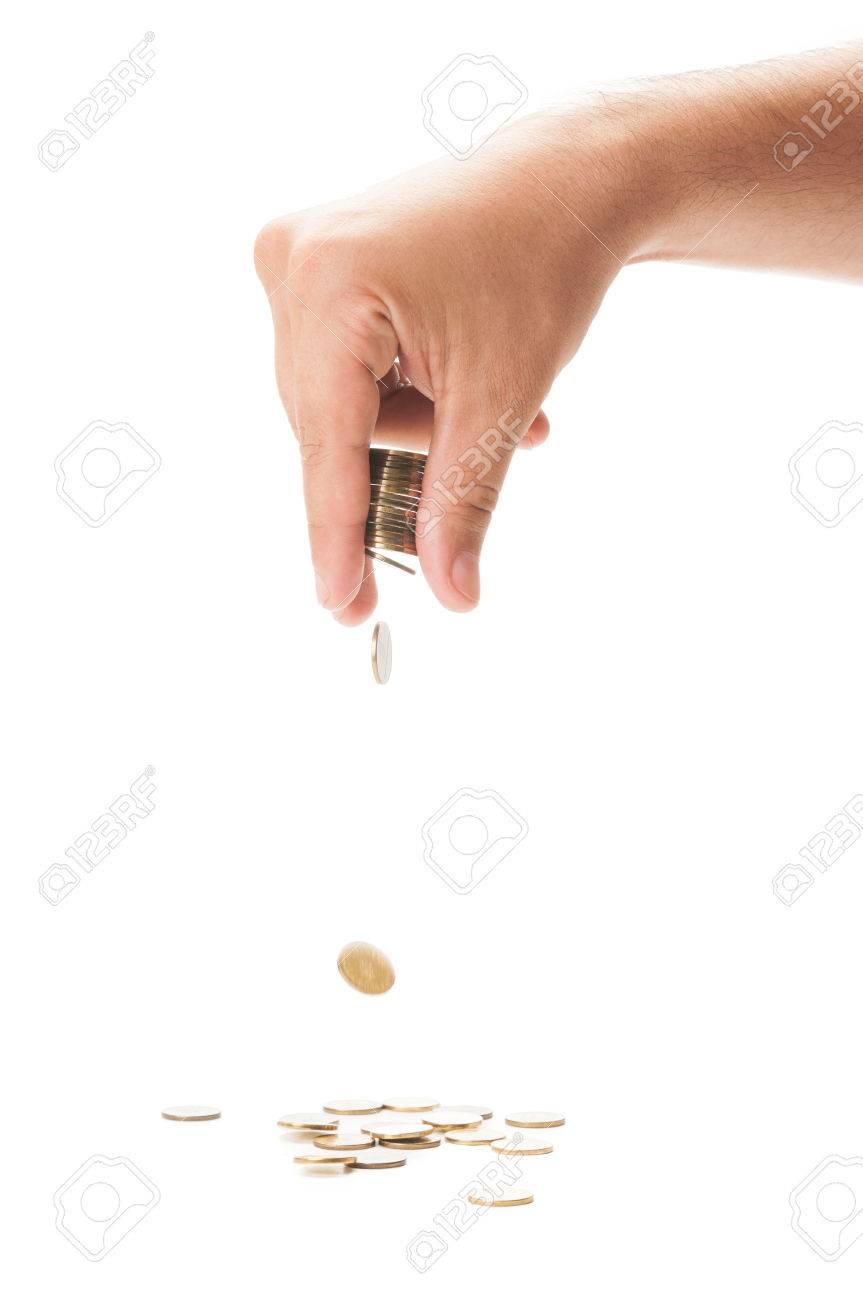 白いテーブルの上のコインの束を落とす手の写真素材・画像素材 Image 29952055