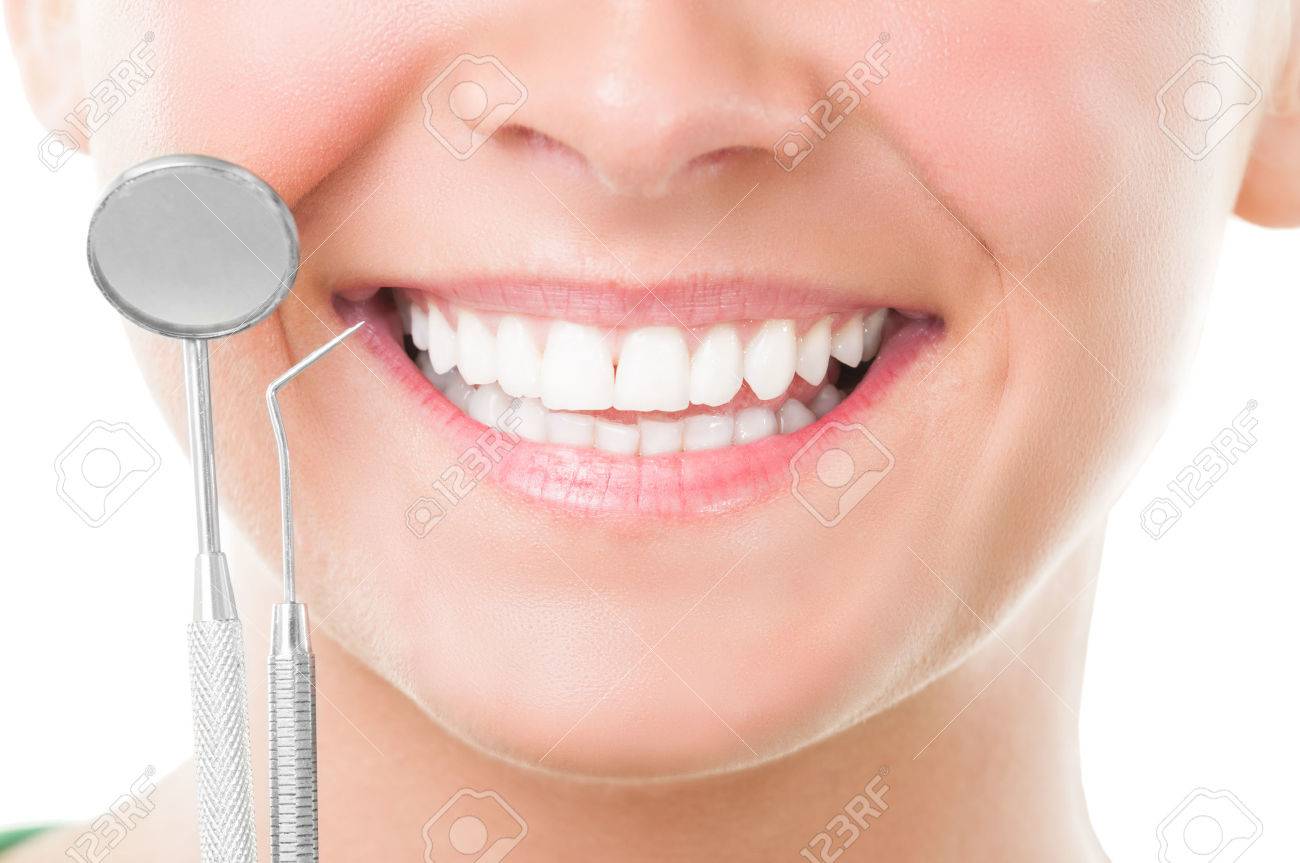 Closeup of perfect smile and dentist tools on white background - 32791311 Closeup of perfect smile and dentist tools on white background - 32791311