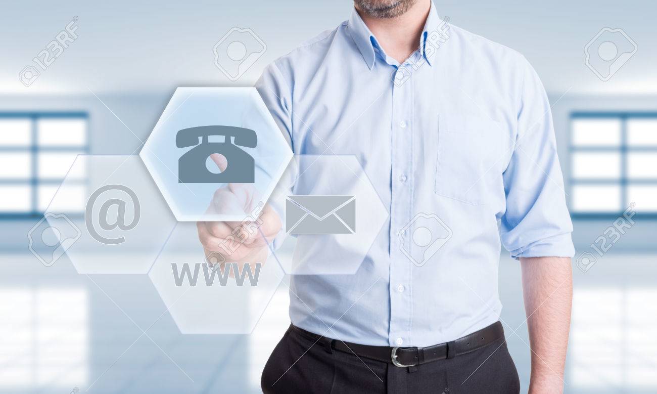 Contact us using phone concept with man pressing button on transparent futuristic touch screen - 40216019 Contact us using phone concept with man pressing button on transparent futuristic touch screen - 40216019