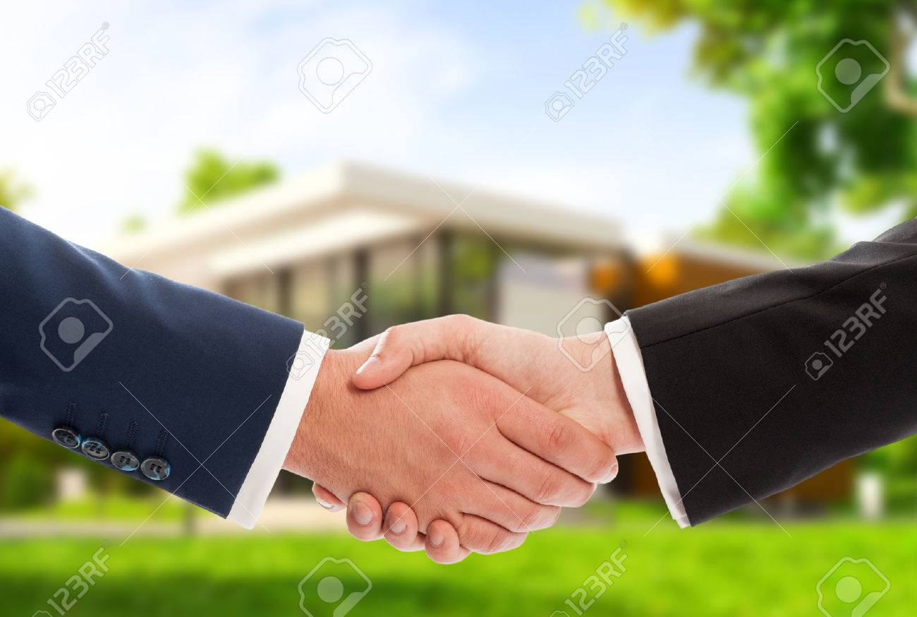 Handshake on house outdoor background as real estate deal or sale concept - 43613225 Handshake on house outdoor background as real estate deal or sale concept - 43613225