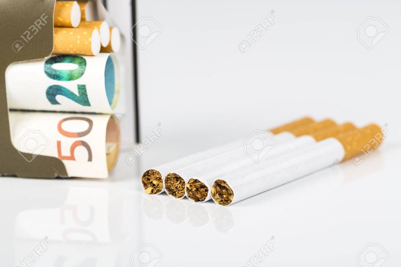 20 and 50 euro banknotes bills cash with cigarettes box of box of cigarettes