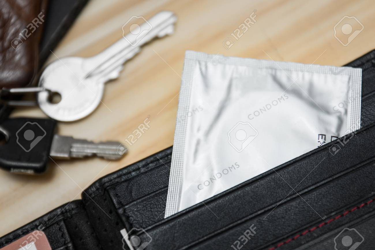 Condom In Wallet, Concept Safe Sex, Male Contraception Stock Photo, Picture  and Royalty Free Image. Image 80874695.