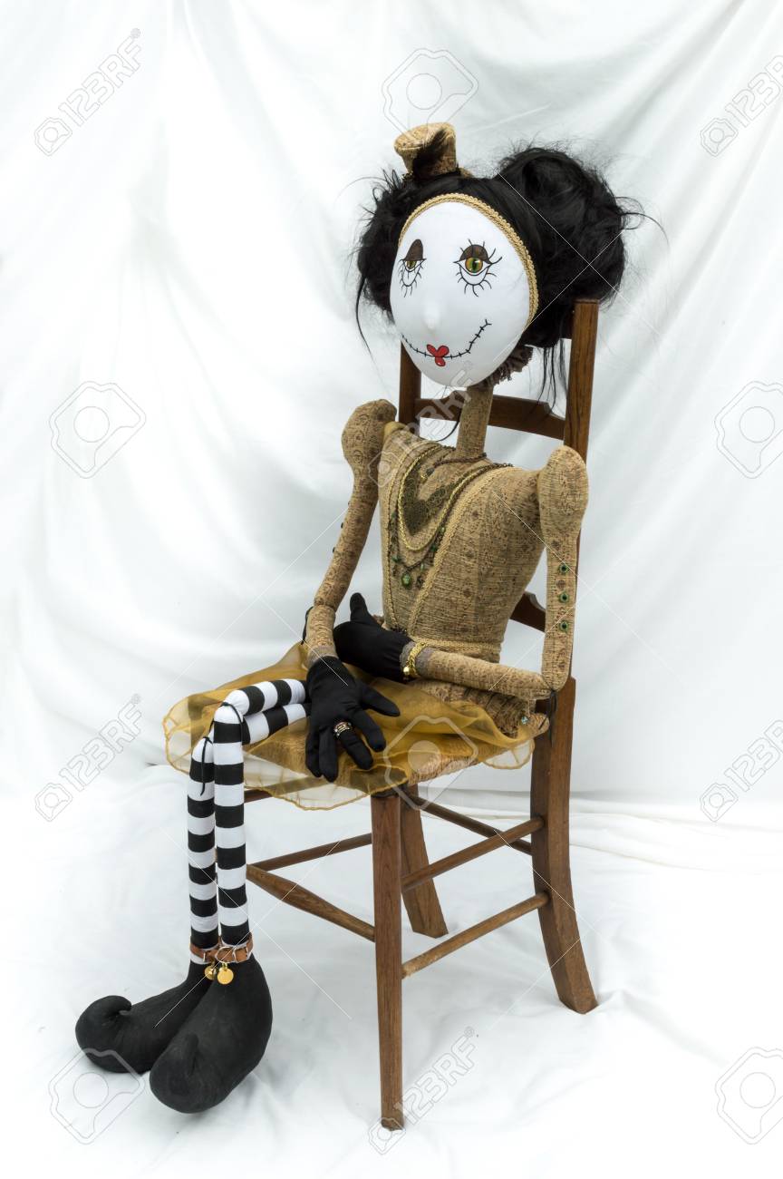 doll sitting in chair