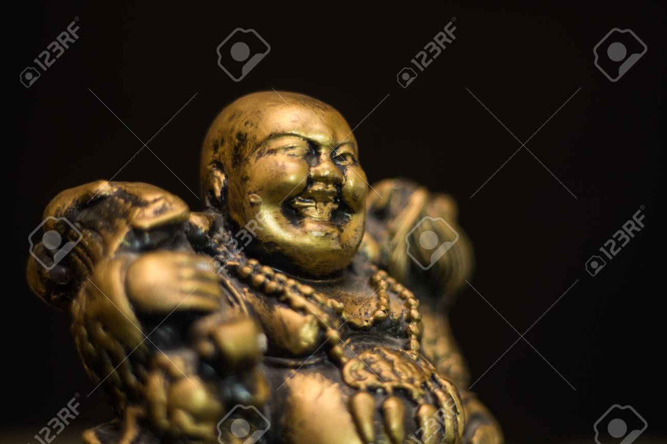 chinese figurine hotei the laughing buddha is a symbol of