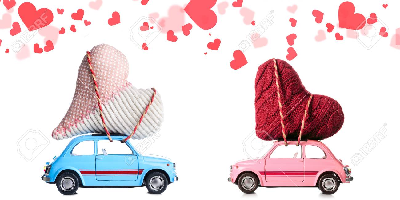 couple of retro toy cars delivering craft hearts for valentines valentines day cars