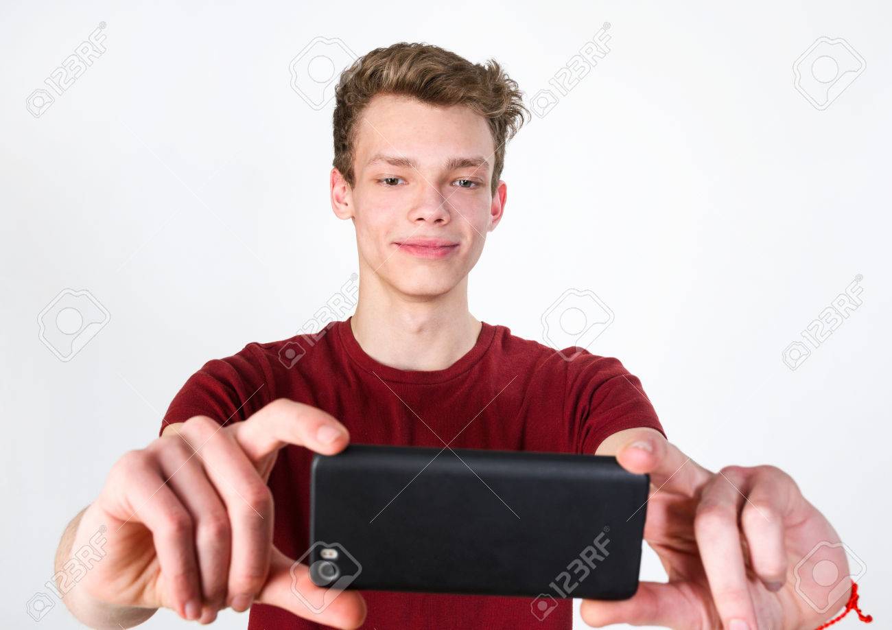 81308245-young-handsome-man-taking-selfie-on-mobile-phone-camera.jpg