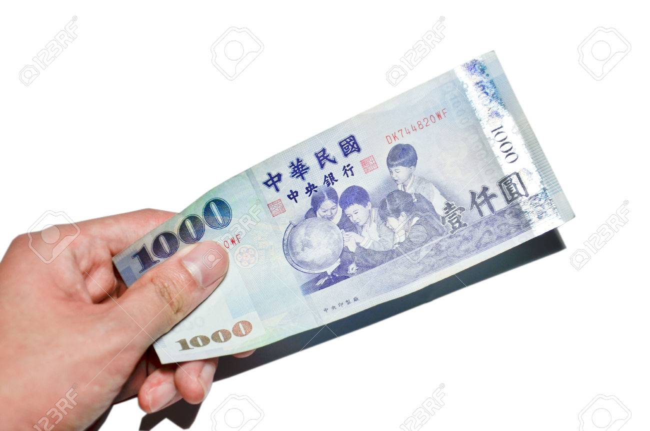 A Hand Holding A 1000 New Taiwan Dollar Bill. Stock Photo, Picture and  Royalty Free Image. Image 25708351.
