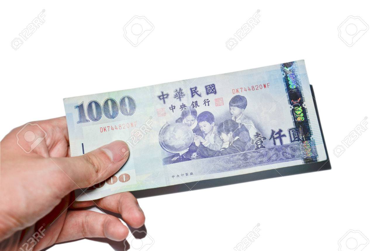 A Hand Holding A 1000 New Taiwan Dollar Bill. Stock Photo, Picture and  Royalty Free Image. Image 26135409.