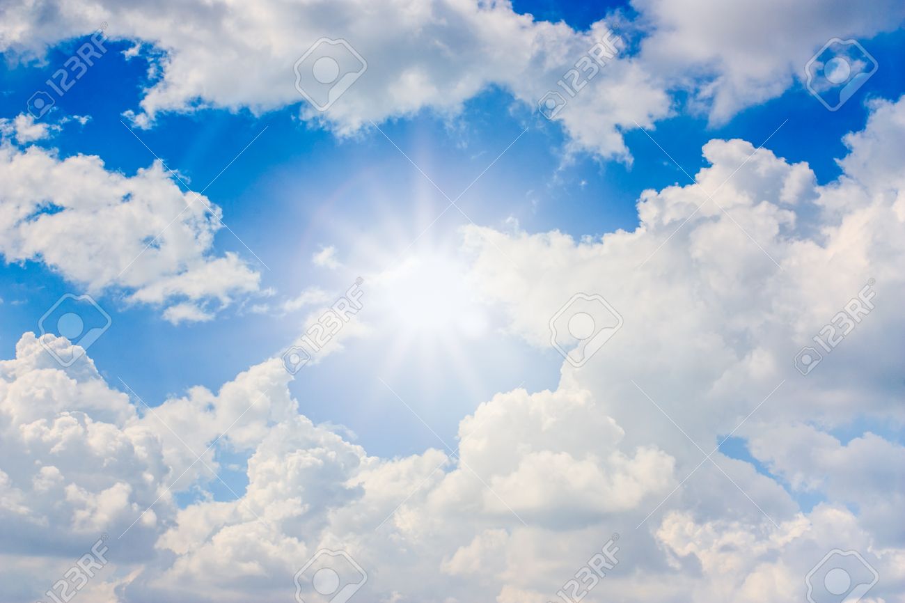 Blue Sky With Sun Ray And White Clouds Stock Photo, Picture And Royalty  Free Image. Image 25242262.