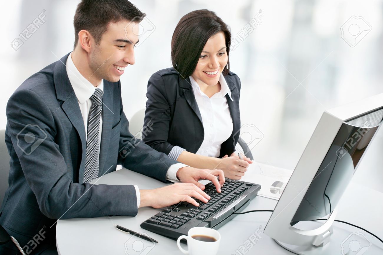 smiling business people with computer in board room stock photo business computer