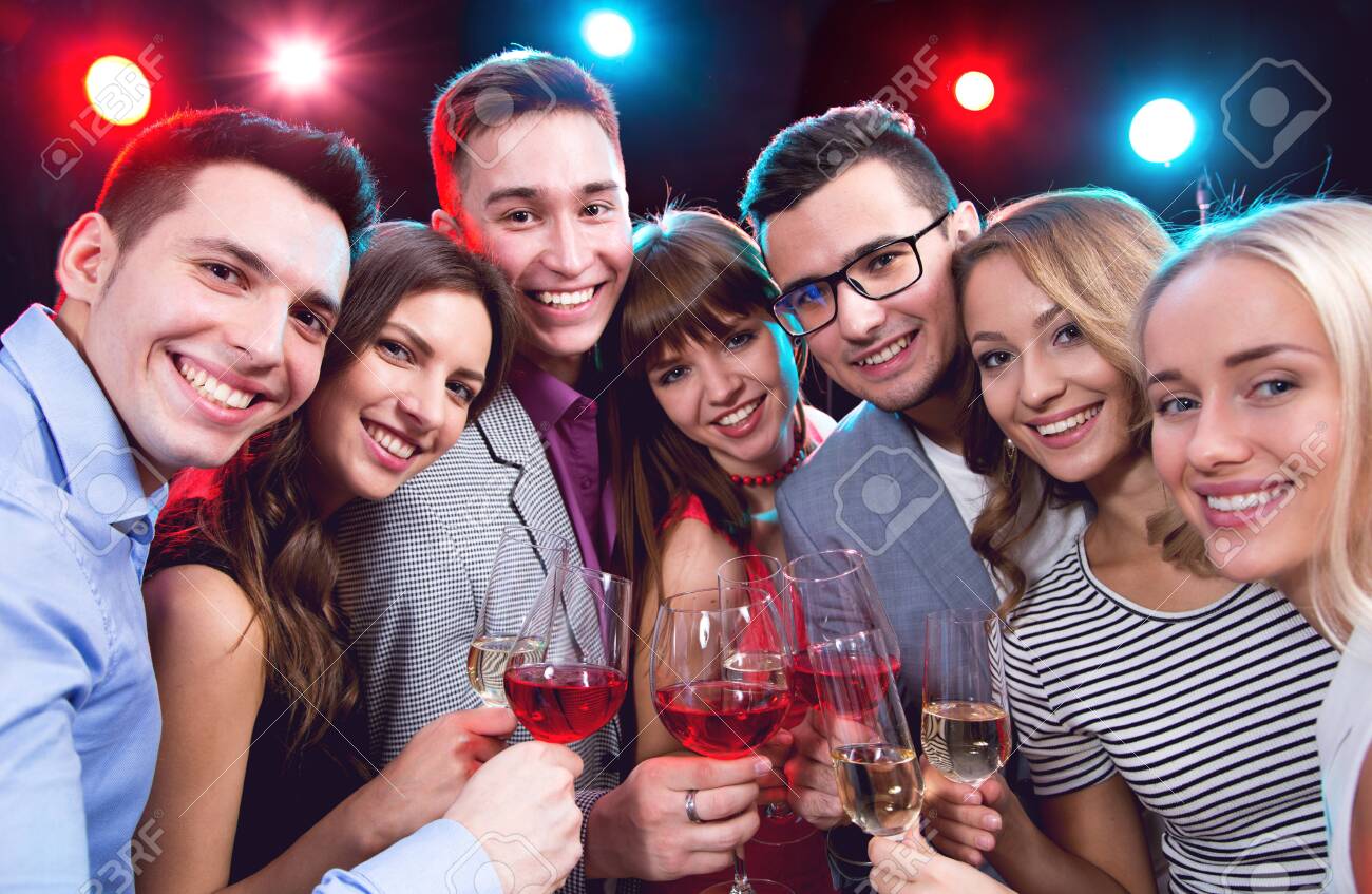 Happy group of young friends touching the glases with each other - 133466480 Happy group of young friends touching the glases with each other - 133466480