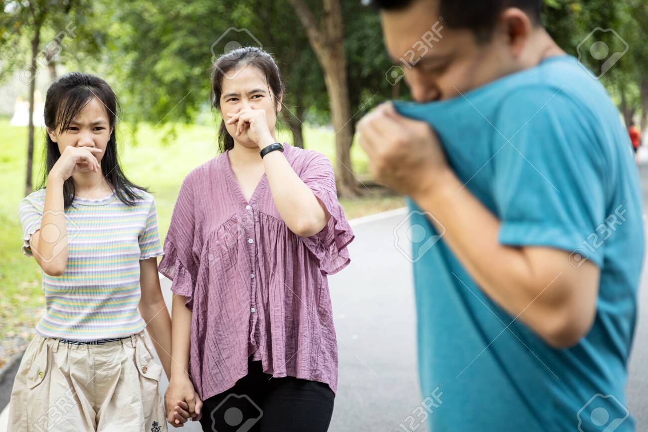 Asian Man Check His Own Smell,sniffing