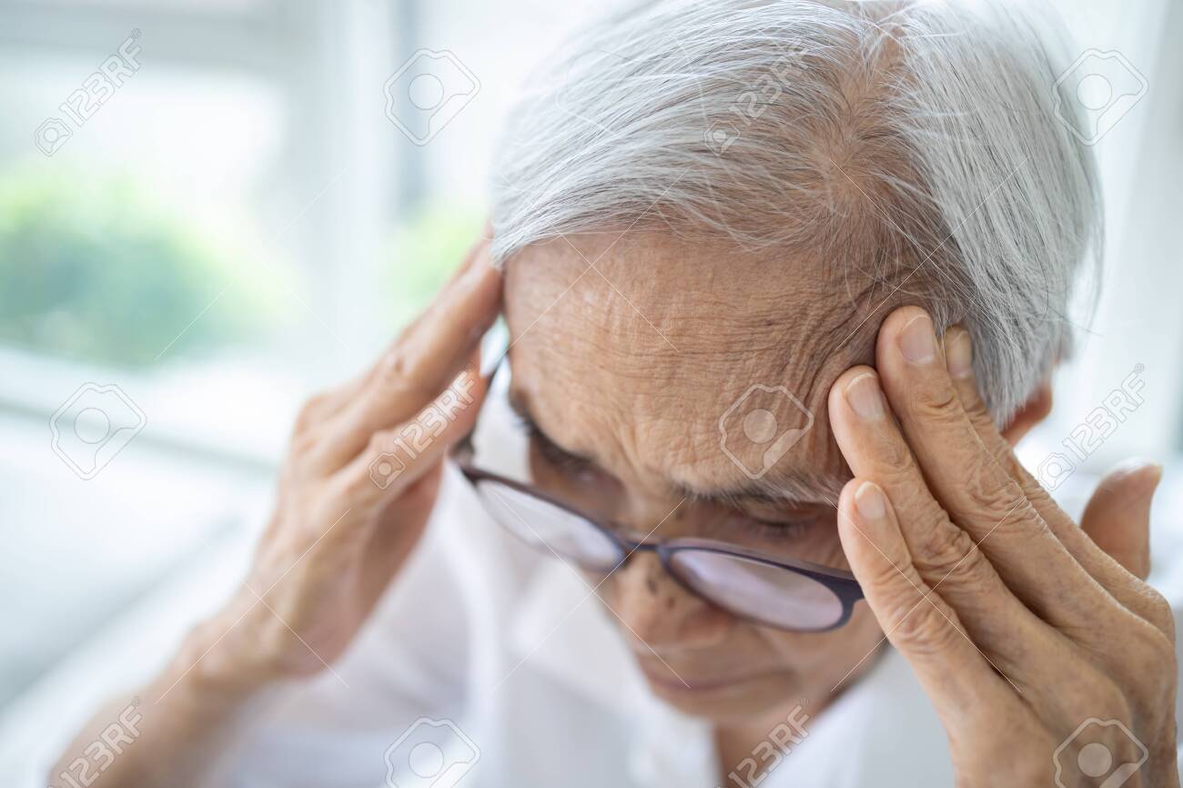 Sick Senior Woman With Headache Pain In The Head Brain System Stock Photo Picture And Royalty Free Image Image 144861674