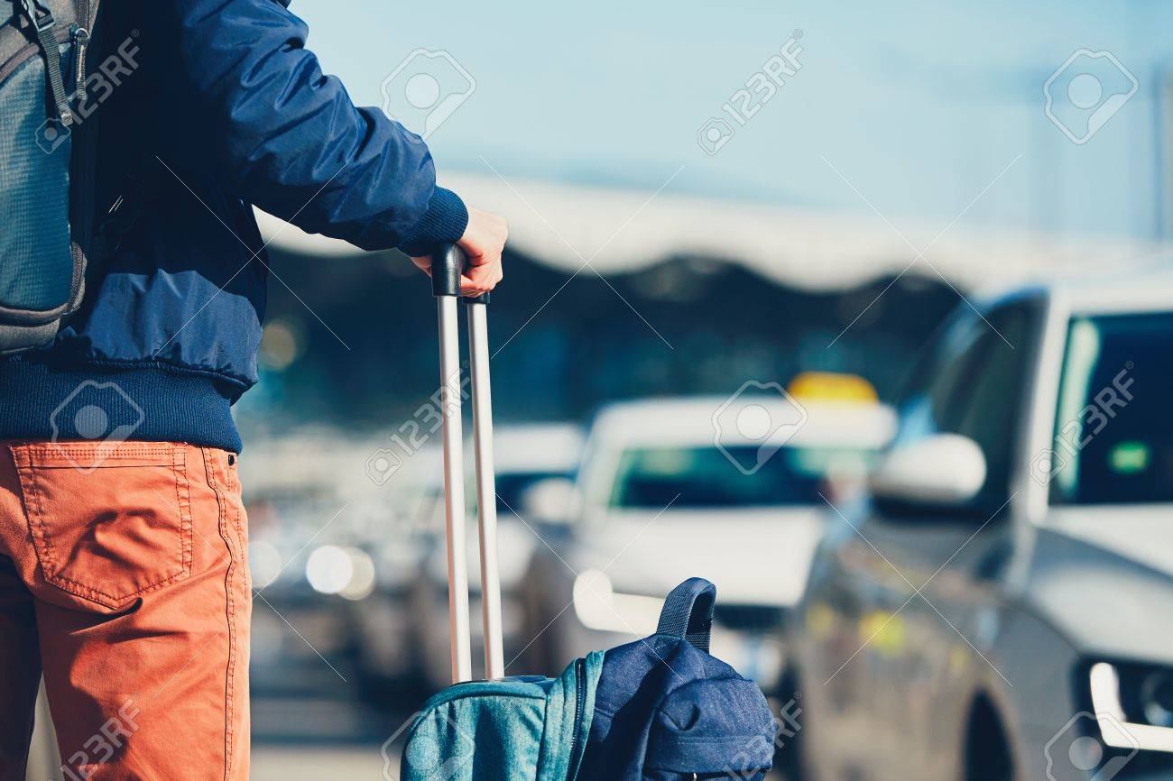 Airport taxi. Passenger is waiting for taxi car. - 72630395 Airport taxi. Passenger is waiting for taxi car. - 72630395